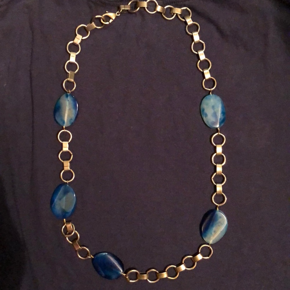 Necklace blue polished stone with brass links.